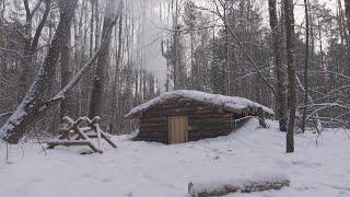 hiding in a huge dugout during a snow storm, spending the night in  bushcraft shelter