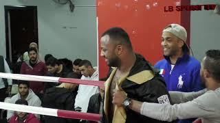 Mourad Omar: black/gold trunks vs Mahmoud Ezzat: red trunks