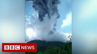 Thousands flee after Indonesian volcano erupts - BBC News