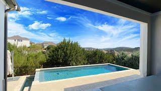 Inside a 4700+ sq ft Toll Brothers Home with a VIEW in the hills of Leander, TX