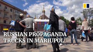 Russian propaganda trucks screen state news in war-torn city of Mariupol