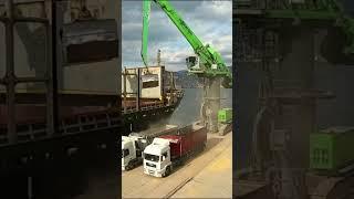 Unloading Cargo Ship with Excavator Crane
