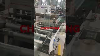 Automatic rewind unit for side gusset central seal bag making machine