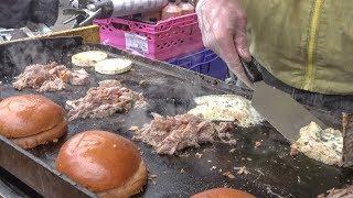 Burger of Duck Pulled Meat and French melted Cheese. London Street Food