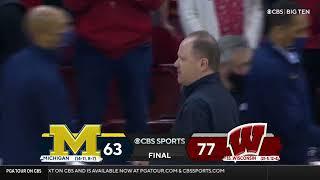 Juwan Howard throws a punch at Wisconsin assistant Joe Krabbenhoft after the Game