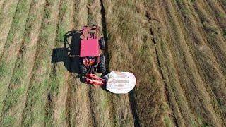 Local Cattle Farmer Cutting and Prepping Hay for Bailing