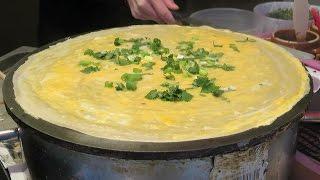 London Street Food. China Style Pancake with Eggs seen in Chinatown