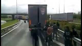 Illegal immigrants and truck drivers in Calais