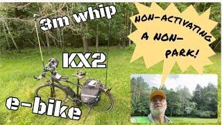 A leisurely non-activation of a non-park with KX2 , whip, e-bike in the company of a horse and sheep