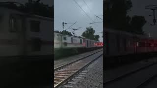 Train 16311 SGNR. KCVL Exp with WAP 7 37152 Erode departing graciously from Bikaner outskirts at eve