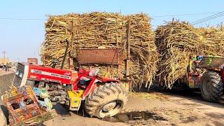 Sugarcane filled Truck crashed in the middle of the Road. we Repair it and run on the raod back.