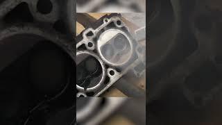 Dry Ice blasting / cleaning a Porsche cylinder head .