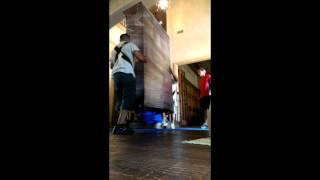 Rescue Moving Services- Moving an armoir upstairs