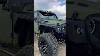 This fully customized army green kevlar Jeep is a BEAST