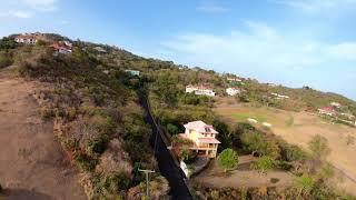 Flight over Cap Estate to see Flamboyant paved road