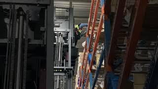 ORDER PICKING ON A WAREHOUSE HIGH REACH ORDER PICKER.