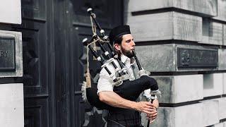 A man plays a bagpipe in Edinburgh Scotland