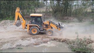 JCB Backhoe Playing With Big Stones Near a Pond - JCB Backhoe Operator