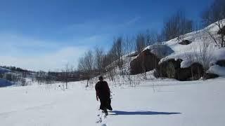 Myanmar Buddhist monk in snow forest of Murmansk where north of Russia.