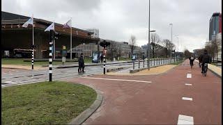 biking through campus to the TU Delft library