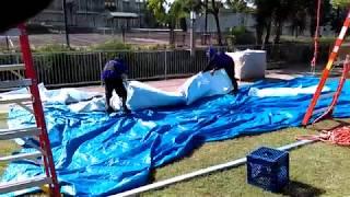 Losberger structure - Pulling tops (roof panels) on a 25m clearspan tent structure