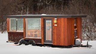 This tiny home on wheels - Big pane windows make the tiny space feel much bigger