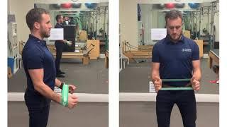 How to perform a Mini Band Front Raise | Shoulder Stability