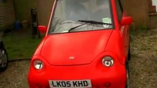 G-wiz electric car. Plugging in to charge