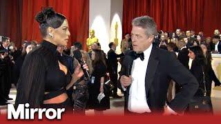 Awkward Hugh Grant interview at Oscars 2023