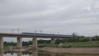 A sleek modern Chinese High Speed Train in Xianyang, Xi'an, China approaching Xian North Station