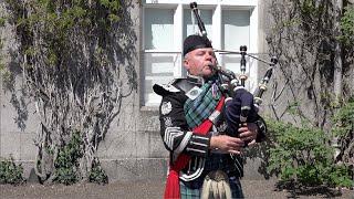 Champion piper Stuart Liddell playing "Braemar Gathering" outside Balmoral Castle in Scotland 2022