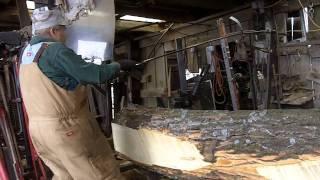 Virgil Storm and his grandson work the sawmill