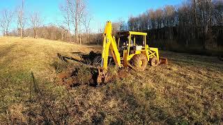 Ditching out Swampy Pastures with the John Deere 310A Backhoe and a Couple Stumps...