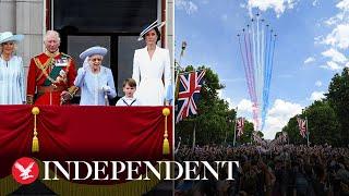 Queen watches spectacular flypast over Buckingham Palace alongside royal family