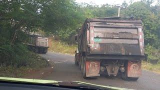 Loaded trucks climbing steep & narrow hill in the countryside mountain ️