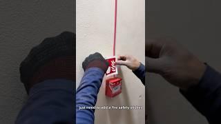 Installing ESP call point with fire safety sticker
