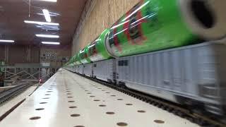 The fastest Silver Bullet train with empty 16 oz SURGE cans riding on top of HO scale cars