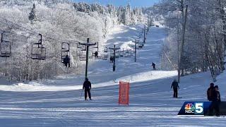 Skiers and snowboarders celebrate a white Christmas Day on the slopes