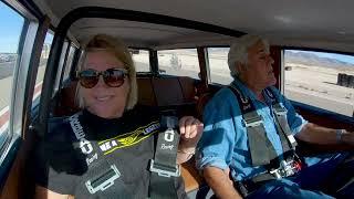 Jay Leno and Suzy Bauter drive her Hot Wheels Legends car on track a 1963 Rambler