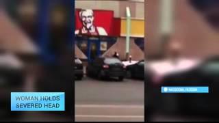 Horror in Moscow: Woman holds child's severed head