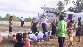 China Kiribati is pictured walking across the backs of people in a traditional welcoming ceremony