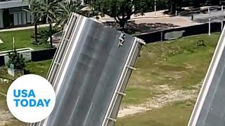 Man scales Florida drawbridge as onlookers watch the terrifying stunt | USA TODAY