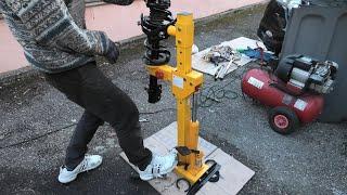 Changing a front shock absorber with a low-priced hydraulic compressor