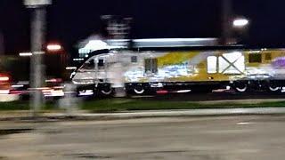 BrightLine train, high speed rail in Florida, USA. At speed across a road crossing.