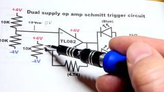 Dual supply op amp schmitt trigger using TL082 with polarity indicator electronics circuit