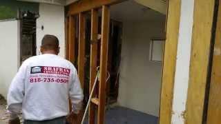 Replacing an exterior door header before a new door is installed by Shafran