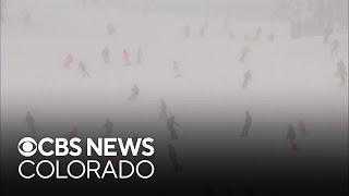 Joyful skiers enjoy opening day at Breckenridge during Colorado snowstorm