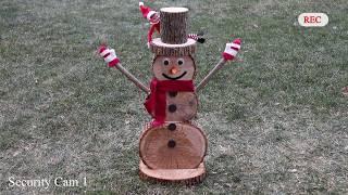 Amazing log snowman made from scratch. Bonus: sneaky elf