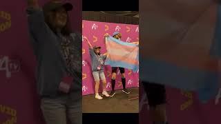 ranboo holds up a trans flag for a fan at vidcon :) STOP HAVING A CIVIL WAR IN THE COMMENTS PLS 