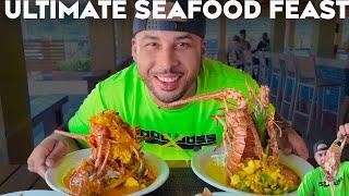 MASSIVE SEAFOOD FEAST OF KING CRAB LOBSTER AND FISH!!! JAMAICA FOOD HISTORY AND CULTURE!